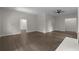 Open-concept living room with hardwood floors, recessed lighting, and neutral color palette at 772 Brookwood Sw Ter, Lilburn, GA 30047