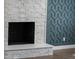 Close up of fireplace and accent wall at 772 Brookwood Sw Ter, Lilburn, GA 30047
