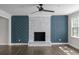 Living room featuring a modern fireplace with decorative blue patterned wall at 772 Brookwood Sw Ter, Lilburn, GA 30047