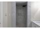 Shower stall featuring pebble flooring and modern tile at 772 Brookwood Sw Ter, Lilburn, GA 30047