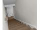 View from top of stairway, showcasing modern design and open door at 772 Brookwood Sw Ter, Lilburn, GA 30047