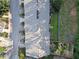 Aerial view of the roof and backyard of the townhome with a fenced yard and mature trees at 1768 Oakbrook Nw Ln # 9, Kennesaw, GA 30152