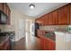 Well-equipped kitchen with granite countertops, modern appliances, and wooden cabinetry at 1768 Oakbrook Nw Ln # 9, Kennesaw, GA 30152