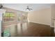 Bright living room with large windows and a sliding door leading to the backyard at 1768 Oakbrook Nw Ln # 9, Kennesaw, GA 30152
