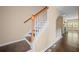 A classic staircase with hardwood steps and white risers leads to the upper level of the home at 1768 Oakbrook Nw Ln # 9, Kennesaw, GA 30152