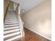 Interior shot featuring a staircase with wooden banister and hardwood floors at 1768 Oakbrook Nw Ln # 9, Kennesaw, GA 30152