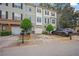 Exterior view of the townhome showing its well-maintained facade, and single car garage at 1768 Oakbrook Nw Ln # 9, Kennesaw, GA 30152