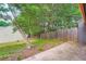 Private backyard with wooden fence and mature trees provides a serene outdoor space at 2027 Jebs Nw Ct, Kennesaw, GA 30144