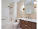 Stylish bathroom with modern vanity, unique mirror, and shower-tub combination at 2027 Jebs Nw Ct, Kennesaw, GA 30144