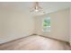 Simple bedroom design with a ceiling fan, light walls, and hardwood floors at 2027 Jebs Nw Ct, Kennesaw, GA 30144