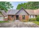 Charming townhouse exterior with a brick facade, gray siding, and well-defined entryway at 2027 Jebs Nw Ct, Kennesaw, GA 30144