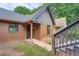 Close-up of a cozy home exterior featuring a brick facade and a inviting front entrance at 2027 Jebs Nw Ct, Kennesaw, GA 30144
