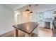Well-lit kitchen boasts stainless steel appliances, white cabinetry, and a large island for prep space at 2027 Jebs Nw Ct, Kennesaw, GA 30144