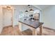 Bright kitchen featuring white cabinets, marble countertops, stainless steel appliances, and a center island at 2027 Jebs Nw Ct, Kennesaw, GA 30144