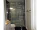 Bathroom featuring a tiled shower with shower system and large vanity at 4125 Fastnet Lane, Duluth, GA 30096