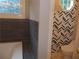 Bathroom featuring unique geometric wallpaper, an octagonal window, and a toilet at 4125 Fastnet Lane, Duluth, GA 30096