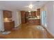 An open-concept kitchen featuring custom wood cabinets and a butcher block island with hardwood floors at 4125 Fastnet Lane, Duluth, GA 30096