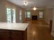 Spacious living room featuring a fireplace, wood floors and natural light at 4125 Fastnet Lane, Duluth, GA 30096