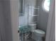 Powder room featuring a unique glass sink and ornate shelving at 4125 Fastnet Lane, Duluth, GA 30096
