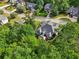 Aerial image showcasing the outdoor living space including a deck or patio and mature trees at 10119 Azalea Dr, Covington, GA 30014