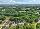 Expansive aerial view showcases the property's location near lush greenery and a meticulously maintained golf course at 10119 Azalea Dr, Covington, GA 30014
