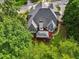 Elevated shot displays outdoor deck surrounded by mature trees at 10119 Azalea Dr, Covington, GA 30014