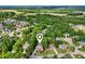 Aerial photo highlights a property's charming exterior, mature landscaping, and desirable neighborhood location at 10119 Azalea Dr, Covington, GA 30014