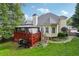 Expansive backyard with a covered patio and grill, great for outdoor living at 10119 Azalea Dr, Covington, GA 30014