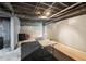 Unfinished basement with exposed ceiling, gray walls, and concrete flooring, ready to be personalized at 10119 Azalea Dr, Covington, GA 30014