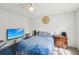 Comfortable bedroom with a soft blue blanket and wooden furniture at 10119 Azalea Dr, Covington, GA 30014