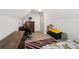 Attic bedroom featuring a low ceiling, hardwood floors, and plenty of storage space at 10119 Azalea Dr, Covington, GA 30014