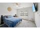 Bright bedroom with a large window and ceiling fan, ideal for relaxation at 10119 Azalea Dr, Covington, GA 30014
