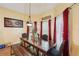 The bright dining area boasts a wooden table, bench seating, and natural light at 10119 Azalea Dr, Covington, GA 30014