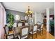 Elegant dining room featuring a large table, stylish chairs, and a chandelier at 10119 Azalea Dr, Covington, GA 30014