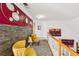 Bright hallway with stylish decor and natural light, leading to the staircase at 10119 Azalea Dr, Covington, GA 30014