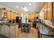 A full kitchen with stainless steel appliances and a center island with seating at 10119 Azalea Dr, Covington, GA 30014