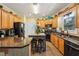 The kitchen features granite counters, an island, and stainless steel appliances at 10119 Azalea Dr, Covington, GA 30014