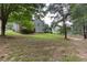 Spacious backyard view of home with deck at 1049 Braddock Cir, Woodstock, GA 30189