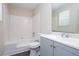 Clean bathroom with tub/shower, blue vanity and updated fixtures at 1049 Braddock Cir, Woodstock, GA 30189