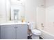 Clean bathroom with a single sink vanity, bathtub-shower combo, and a modern design for everyday comfort at 1049 Braddock Cir, Woodstock, GA 30189