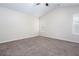 Neutral bedroom with carpet, ceiling fan, high ceiling and windows at 1049 Braddock Cir, Woodstock, GA 30189