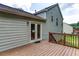 View of home's deck featuring wood railing and double doors to inside at 1049 Braddock Cir, Woodstock, GA 30189