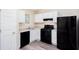Efficient kitchen featuring white cabinetry, modern appliances, and ample counter space, designed for functionality and style at 1049 Braddock Cir, Woodstock, GA 30189