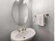 Charming bathroom with a vessel sink, oval mirror, and updated fixtures at 1403 Ashford Creek Ne Cir, Atlanta, GA 30319