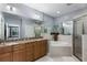 Luxurious bathroom with a soaking tub, double vanity, granite counters, and a glass-enclosed shower at 1403 Ashford Creek Ne Cir, Atlanta, GA 30319