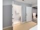 Neutral toned bedroom leading to an ensuite bathroom and potential storage area at 1403 Ashford Creek Ne Cir, Atlanta, GA 30319