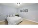 Bright bedroom with neutral walls, plush carpet, and minimalist decor at 1403 Ashford Creek Ne Cir, Atlanta, GA 30319