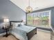 Bedroom featuring a large window, pendant lighting, and ample space at 1403 Ashford Creek Ne Cir, Atlanta, GA 30319