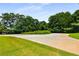 Circular driveway with well-maintained landscaping, enhancing the curb appeal of the property at 1403 Ashford Creek Ne Cir, Atlanta, GA 30319