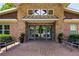 Attractive building entrance with brickwork, seating benches, and lush landscaping at 1403 Ashford Creek Ne Cir, Atlanta, GA 30319